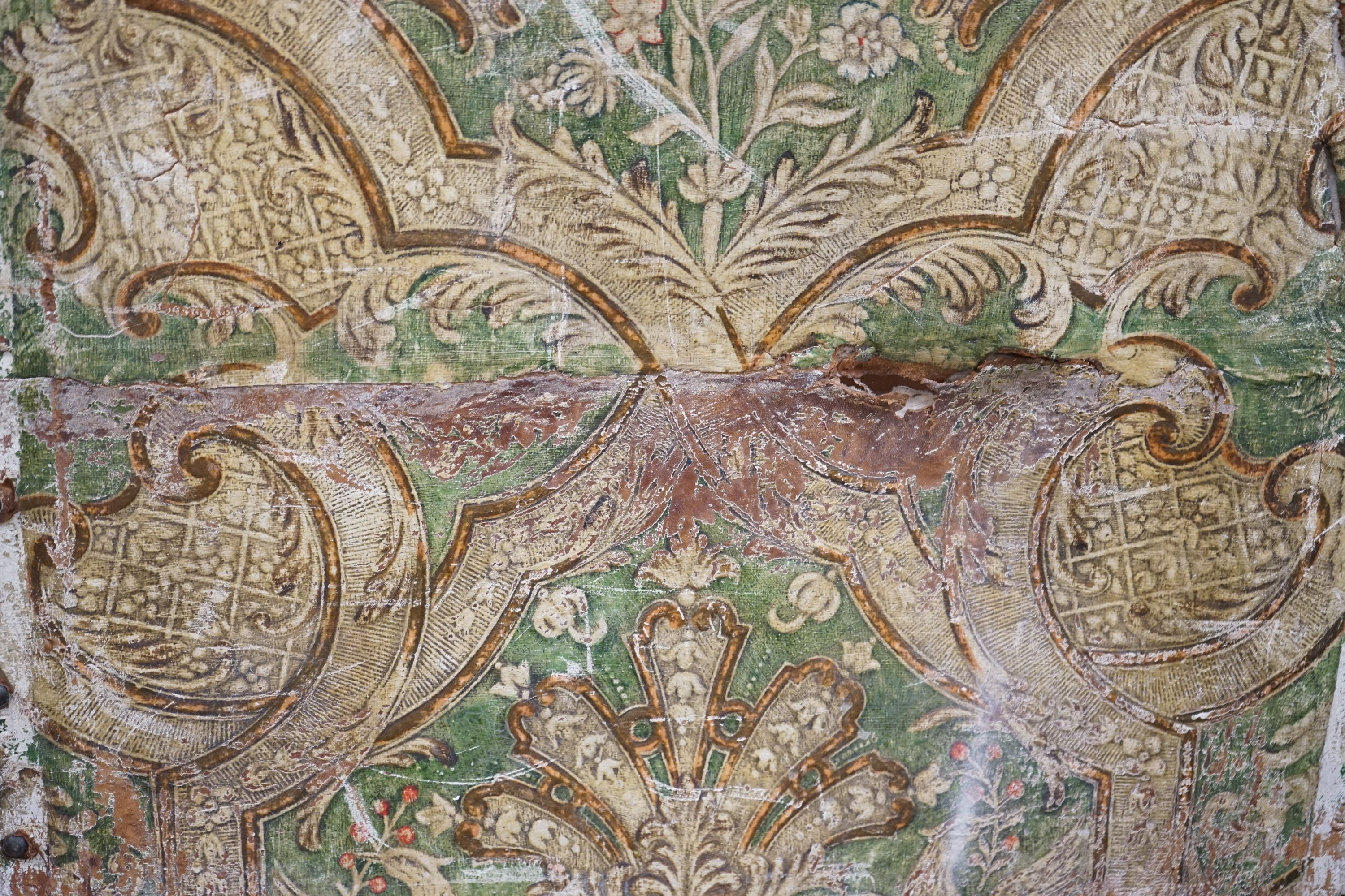A Spanish painted leather three fold dressing screen, each panel width 60cm, height 237cm
